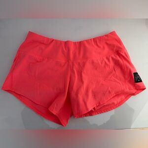 Oiselle Women's Roga Shorts in bright coral